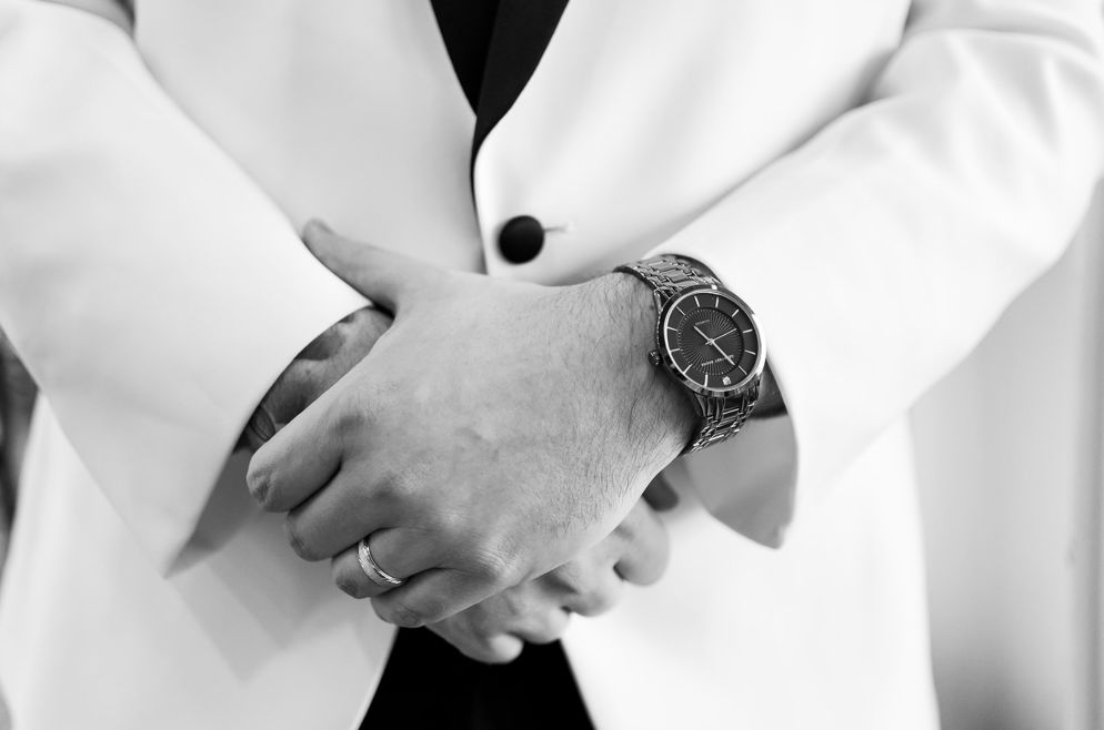 Groom's hands.