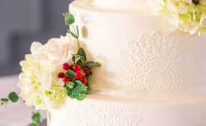 Intricate and decorative details on a multi-layered wedding cake.