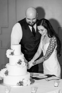 Bride and groom cut the wedding cake.