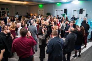 Guests fill the dancefloor at the reception.