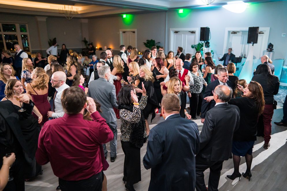 Guests fill the dancefloor at the reception.