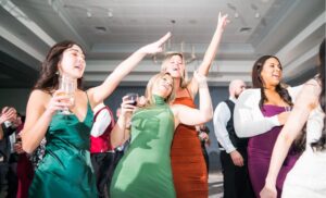 Women singing at the wedding reception.