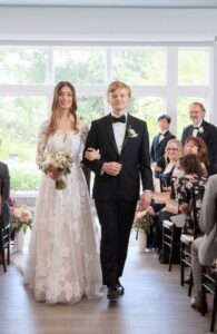 Bride and groom walk the aisle.
