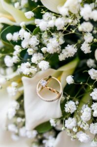 Wedding rings on a bouquet.