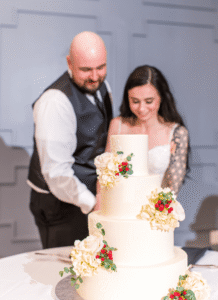 Bride and groom cut the cake.