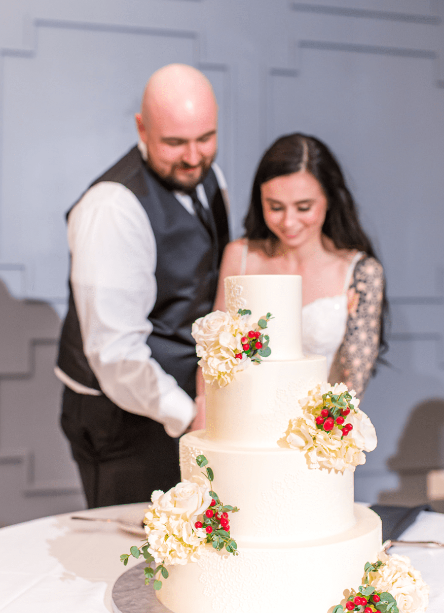 Bride and groom cut the cake.
