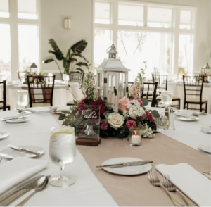 Table setting with flowers and lantern.