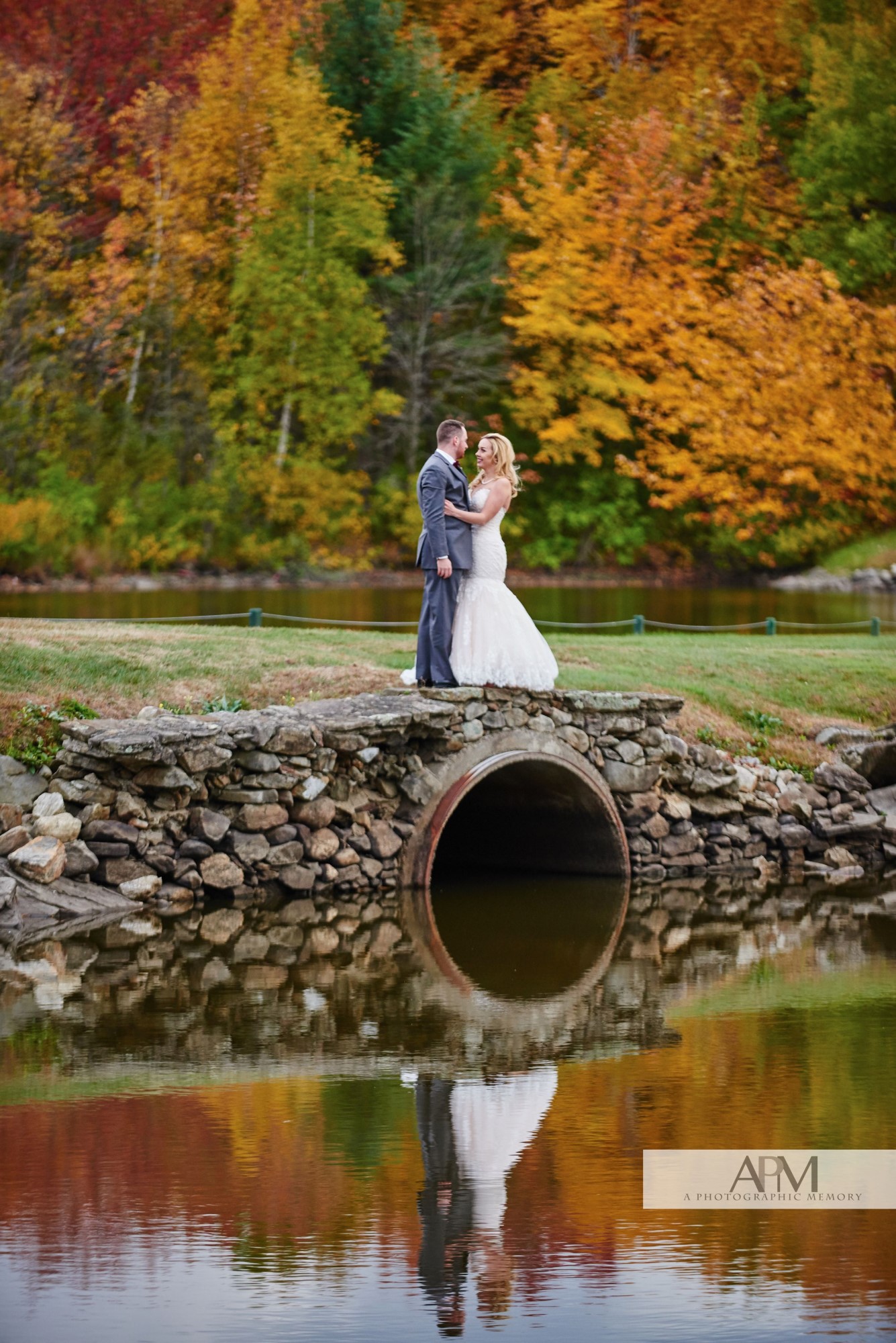 Bride and groom by the water.