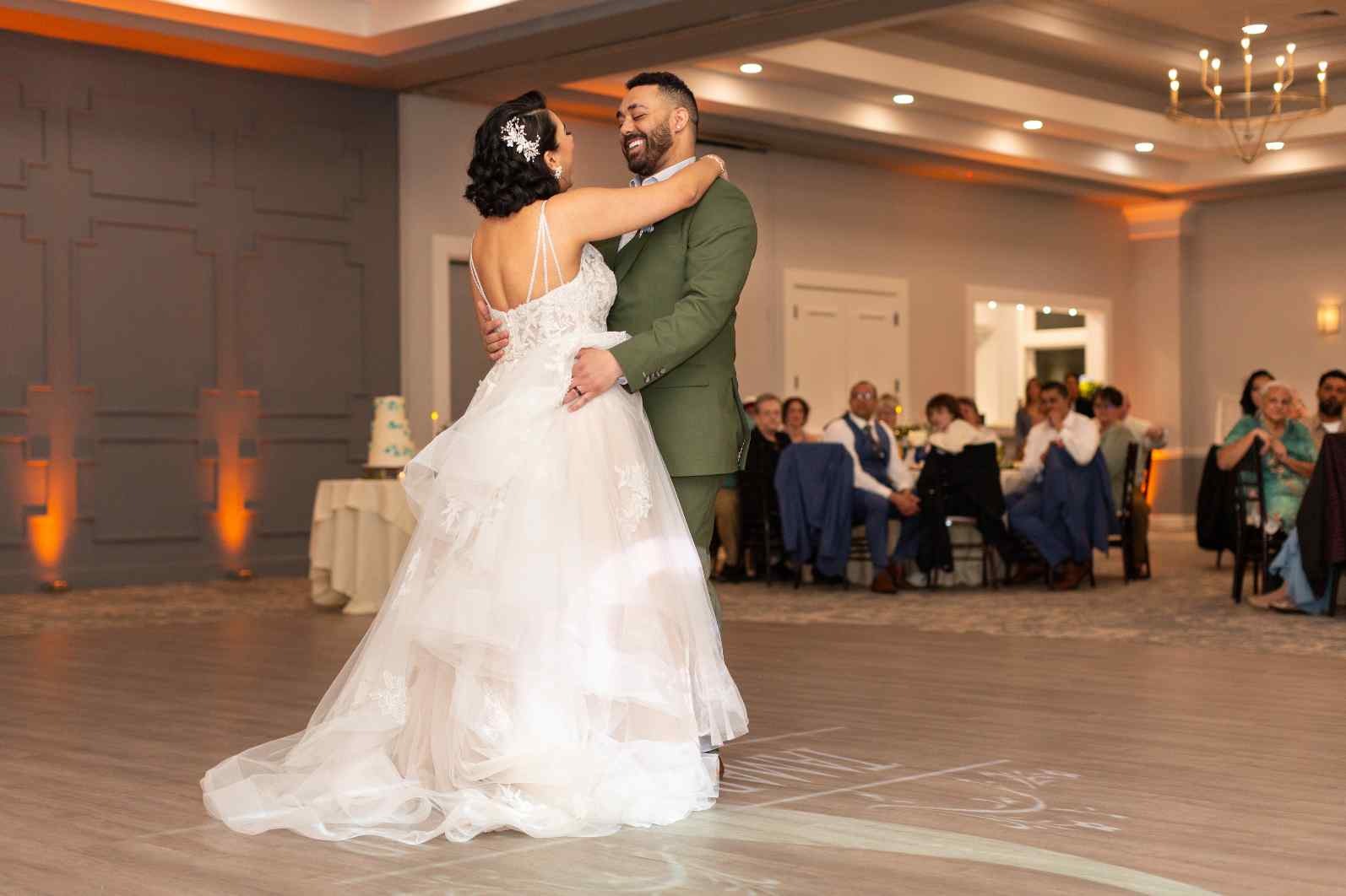 Bride and groom take their first dance as a married couple in the elegant Sky Meadow Ballroom.